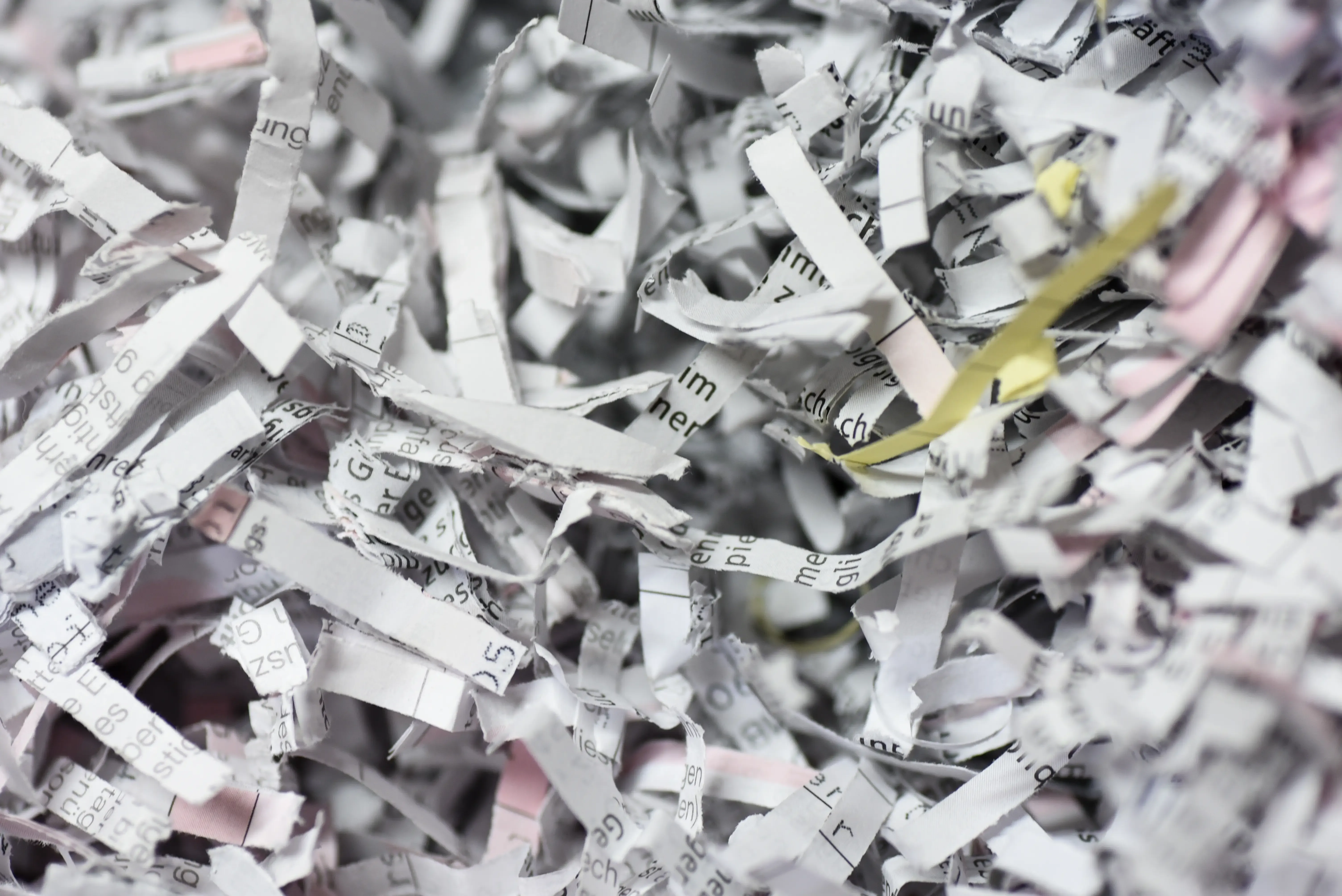A pile of little rectangular pieces of newspaper.