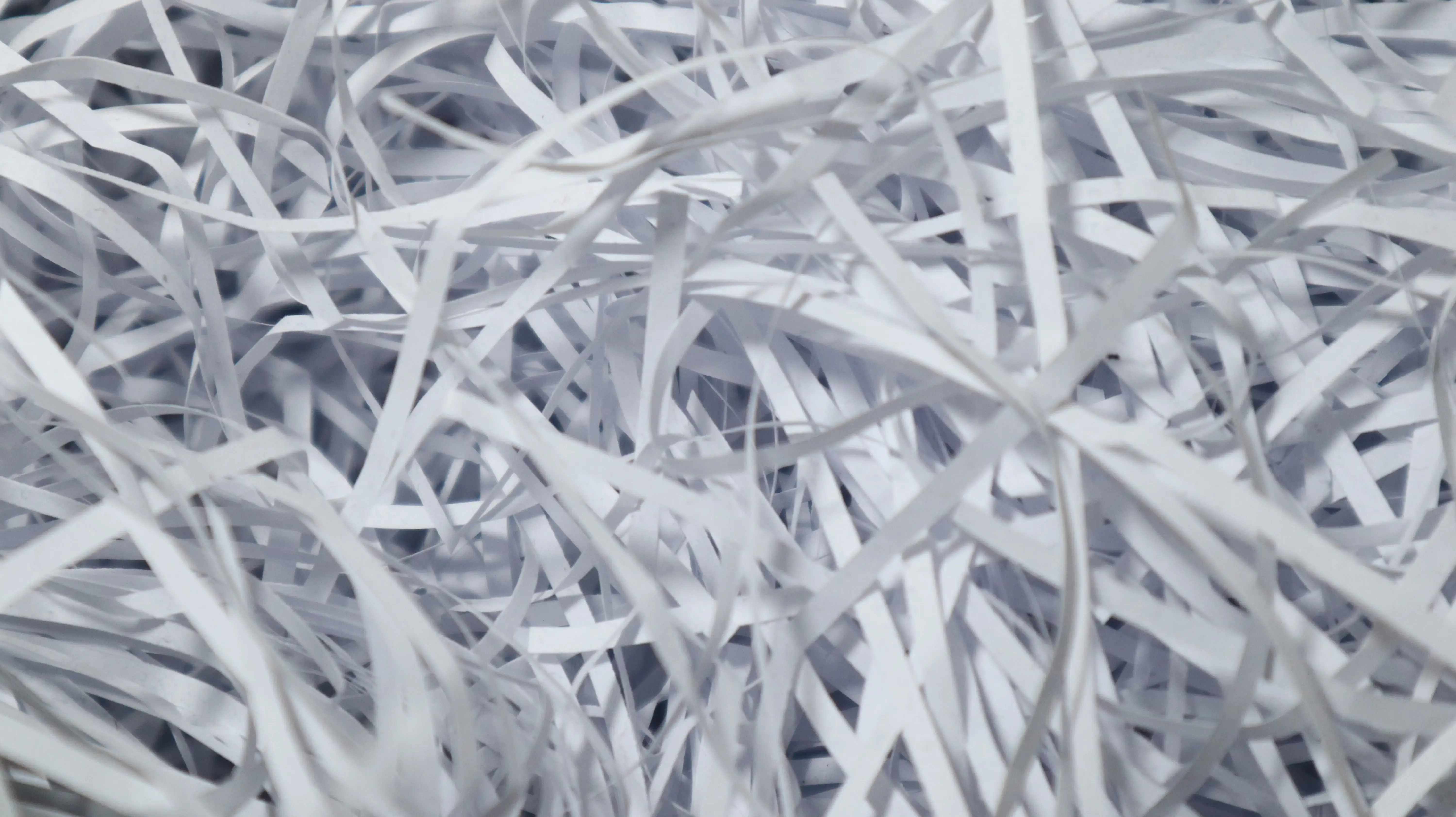 a pile of white paper strips
