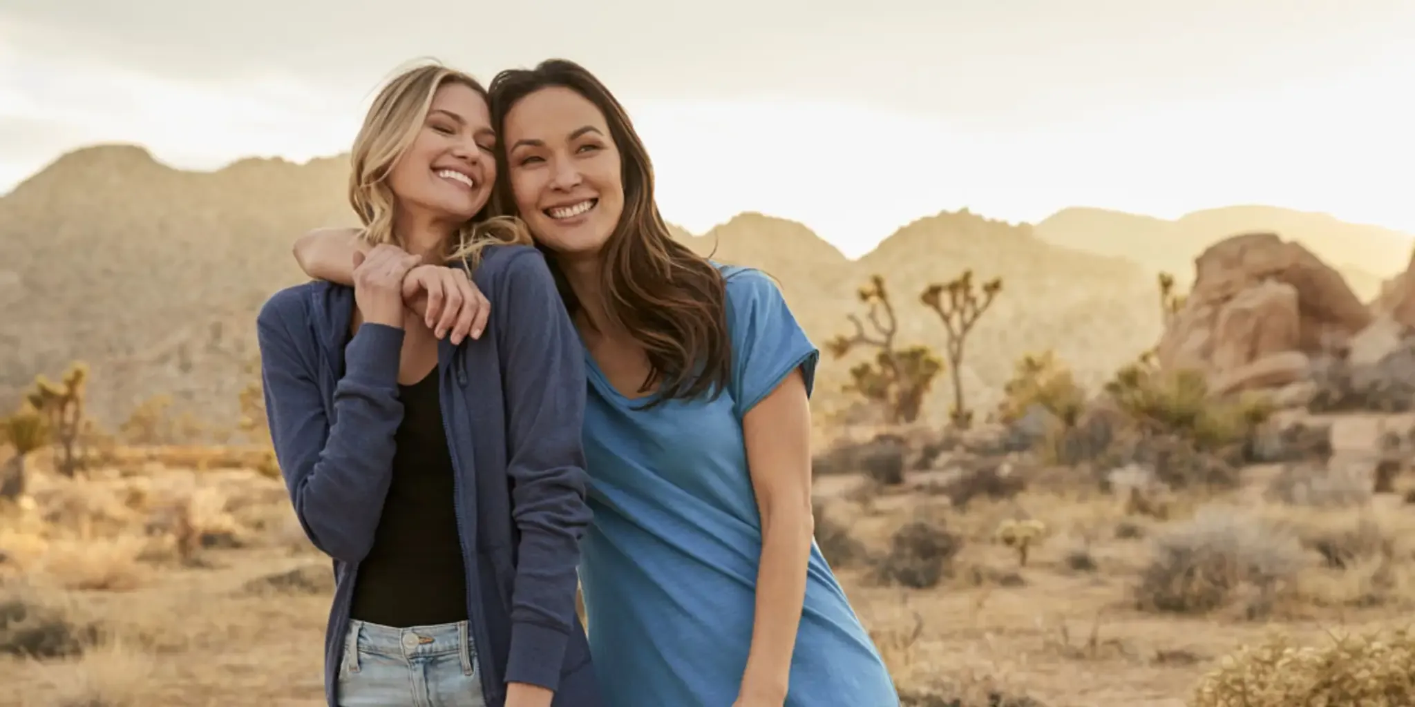 Two smiling women in Pact clothing standing outside Two smiling women in Pact clothing standing outside