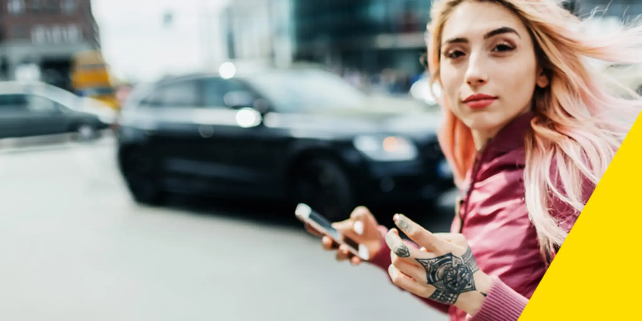 A young woman holding a phone